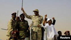 FILE: Lieutenant General Mohamed Hamdan Dagalo, deputy head of the military council and head of paramilitary Rapid Support Forces (RSF), greets his supporters as he arrives at a meeting in Aprag village, 60 kilometers away from Khartoum, Sudan, June 22, 2019.