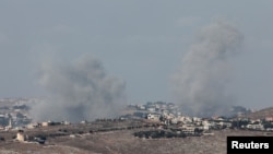 Smoke billows near Nabatieh, amid ongoing hostilities between Hezbollah and Israeli forces, as seen from Marjayoun