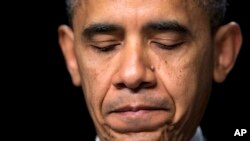 President Barack Obama pauses as he speaks at the National Prayer Breakfast, Washington, Feb. 7, 2013.