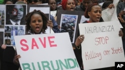 Burundi nationals from across the U.S. and Canada, along with supporters, demonstrate outside U.N. headquarters, calling for an end to political atrocities and human rights violations unfolding in Burundi under the government of President Pierre Nkurunziza, Tuesday, April 26, 2016, in New York.