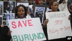 FILE - Burundi nationals from across the U.S. and Canada, along with supporters, demonstrate outside U.N. headquarters, calling for an end to political atrocities and human rights violations unfolding in Burundi under the government of President Pierre Nkurunziza, April 26, 2016..