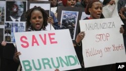 FILE - Burundi nationals from across the U.S. and Canada, along with supporters, demonstrate outside U.N. headquarters in New York, calling for an end to political atrocities and human rights violations unfolding in Burundi under the government of President Pierre Nkurunziza, April 26, 2016.