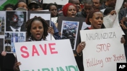 FILE - Burundi nationals from the U.S. and Canada and their supporters demonstrate outside U.N. headquarters in New York, calling for an end to political atrocities and human rights violations under the government of President Pierre Nkurunziza, April 26, 2016. 