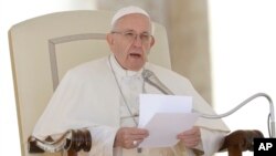 Pope Francis delivers his message during his weekly general audience in St. Peter's Square at the Vatican, Sept. 26, 2018. 