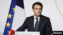 French President Emmanuel Macron delivers a speech during a meeting with representatives of families of 1962 repatriates from Algeria at the Elysee Palace, in Paris. Taken 1.26.2022