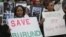 FILE - Burundi nationals from across the U.S. and Canada demonstrate outside U.N. headquarters in April, calling for an end to political atrocities and human rights violations unfolding in Burundi under the government of President Pierre Nkurunziza.