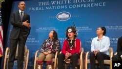 President Barack Obama speaks as, from left, Tatiana Ticknor of the Yup'ik/Tlingit/Dena'ina, Brayden White of the St. Regis Mohawk Tribe and Blossom Johnson of the Navajo Nation listen during the 2015 White House Tribal Nations Conference, Nov. 5, 2015.