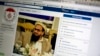 FILE - A photo shows a Facebook site that features one of India’s most wanted, Hafiz Saeed, the founder of Lashkar-e-Taiba, a banned organization and a U.S. declared terrorist group, in Islamabad, Pakistan, July 7, 2017. 