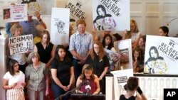 Vicky Chavez, center, speaks during a news conference while supporters look on at the First Unitarian Church in Salt Lake City, July 9, 2018. Chavez, a Honduran woman who has been taking sanctuary with her two daughters in the church for the past six months, is vowing to fight for her asylum case and seek relief from a federal appeals court.