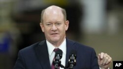 FILE - Senator Chris Coons, D-Del., speaks at an Amtrak facility in Bear, Deleware, November 6, 2023.