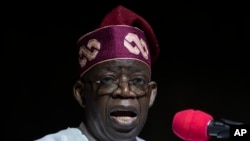 Rais wa Nigeria Bola Tinubu akiwahutubia wafuasi wake na nchi nzima baada ya kupokea cheti chake cha kushinda urais kwenye sherehe mjini Abuja, Nigeria Jumatano, Machi 1, 2023.