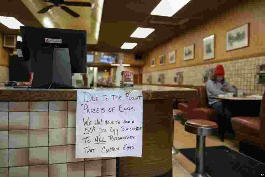 A sign is posted at the register read &quot;Due to the recent price of eggs, we will have to add a .50 cent per egg surcharge to all breakfasts that contain eggs.&quot; at the Pepper Pod Restaurant in Newport, Kentucky.