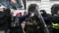 FILES - Riot police push back a crowd of supporters of then-President Donald Trump after they stormed the U.S. Capitol on January 6, 2021, in Washington.