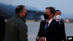 U.S. Secretary of State Antony Blinken talks with Lt. Gen. Scott Pleus, deputy commander of U.S. Forces Korea, before he boards a plane at the Osan Air Base in Pyeongtaek, South Korea, March 18, 2021.