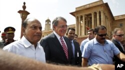 U.S. Defense Secretary Leon Panetta, second left, walks with Indian Defense Minister A.K. Antony, left, to the defense minister's office, in New Delhi, India, Wednesday, June 6, 2012. 