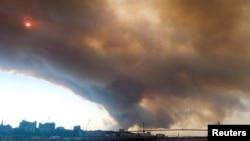 Smoke rises from a wildfire, in Halifax, Nova Scotia, Canada, May 28, 2023 in this still image obtained from social media video. Meenakshi Guchhait/via REUTERS