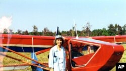 Jeanette Smolinski in front of the ultralight she built, with her father, in her spare time. (Courtesy J. Smolinski)