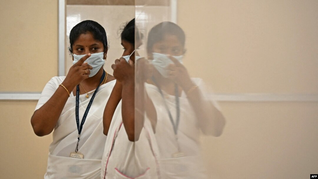 FILE - Nurses speak inside a newly created mpox isolation ward at a hospital in Chennai, India, Aug. 27, 2024.
