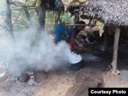 A woman cooks over a wood-burning fire in India, July 2014. (Global Alliance for Clean Cookstoves)