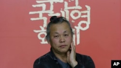 South Korean director Kim Ki-duk poses before an interview at the Busan International Film Festival in Busan, South Korea, October 5, 2015