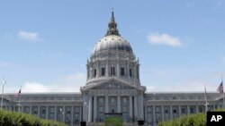 FILE - San Francisco City Hall is seen in a July 1, 2014, photo. City officials are to clarify guidelines under which federal deportation authorities should be contacted if an immigrant in the U.S. illegally is detained.