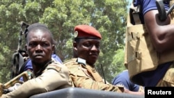 FILE PHOTO: Burkina Faso's new military leader Ibrahim Traore is escorted by soldiers in Ouagadougou