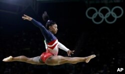 United States' Simone Biles performs on the balance beam during the artistic gymnastics women's team final at the 2016 Summer Olympics in Rio de Janeiro, Brazil, Aug. 9, 2016.