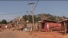 People are seen on a street of abandoned houses and stores, in Kumbo, Cameroon, Jan. 3, 2019.