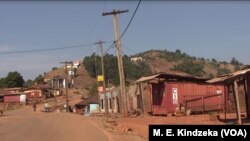 People are seen on a street of abandoned houses and stores, in Kumbo, Cameroon, Jan. 3, 2019.