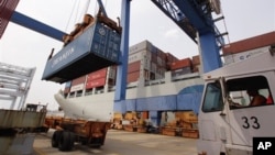 A container ship from China is offloaded at Massport's Conley Terminal in the port of Boston. 
