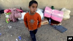 Suleiman, 8, a Syrian boy who fled to Lebanon this morning with his family from the town of Qusair after it fell to Syrian forces loyal to President Bashar Assad and Hezbollah fighters, June 5, 2013.