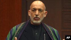 Afghan President Hamid Karzai speaks to the media during a news conference, December 12, 2012.