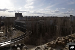 FILE - A view of the city of Pripyat from the 9th floor of an abandoned hotel room. (VOA Photo/D. Markosian)