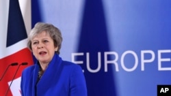 FILE - British Prime Minister Theresa May speaks during a media conference at the conclusion of an EU summit in Brussels, Nov. 25, 2018. 