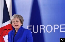 FILE - British Prime Minister Theresa May speaks during a media conference at the conclusion of an EU summit in Brussels, Nov. 25, 2018.