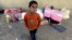 Suleiman, 8, a Syrian boy who fled to Lebanon this morning with his family from the town of Qusair after it fell to Syrian forces loyal to President Bashar Assad and Hezbollah fighters, June 5, 2013.