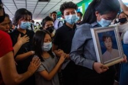 Family members of Khant Ngar Hein grieve during his funeral in Yangon, Myanmar, March 16, 2021. Khant Ngar Hein, a 18-year-old student of medicine was shot on his chest on March 14, in Tamwe, Yangon, by security forces.