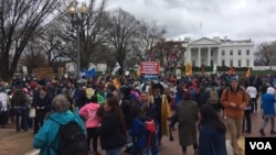 “Water protectors” rallied after their march outside the White House to speak out against the administration’s decision to continue construction of the Dakota Access Pipeline (E. Sarai/VOA)