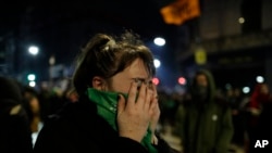 A pro-choice activist holds her face after lawmakers voted against a bill that would have legalized elective abortion in the first 14 weeks of pregnancy, outside Congress in Buenos Aires, Argentina, early Thursday, Aug. 9, 2018. (AP)