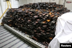 A cache of weapons is assembled on the deck of the USS Gravely in the Arabian Sea in this U.S. Navy picture taken March 31, 2016. The weapons were seized from a stateless dhow which was intercepted by the USS Sirocco on March 28, 2016.