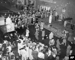 FILE - Greenwich Village in New York City, where anything can and generally does happen, held an old fashioned block party in which residents from all boroughs attended, June 21, 1946. (AP Photo/Ed Ford)