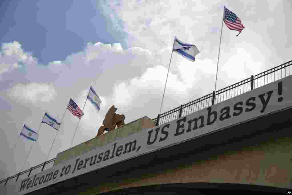 A sign on a bridge leading to the U.S. Embassy compound ahead the official opening in Jerusalem, May 13, 2018. 