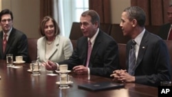 President Barack Obama listens to House Speaker John Boehner of Ohio, second from right, during a bipartisan meeting with House and Senate leadership in the Cabinet Room of the White House in Washington, April 13, 2011