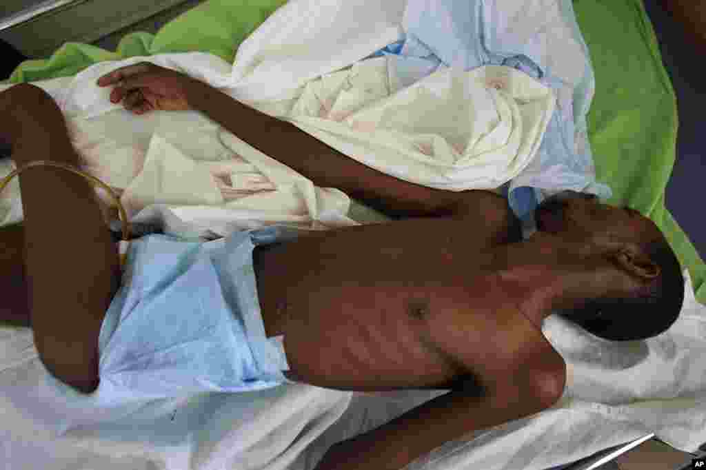 FILE - A man that did not want to be identified lies in a ward that specializes in AIDS treatment at a hospital in Dakar, Senegal.