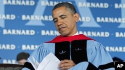 President Barack Obama reads over a program before delivering the commence address at Barnard College, New York, May 14, 2012.