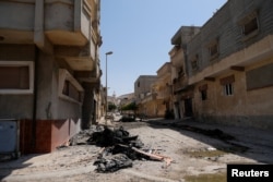 A view of destroyed buildings and cars after forces loyal to Libyan commander Khalifa Haftar took control of the area, in Derna, Libya, June 13, 2018.