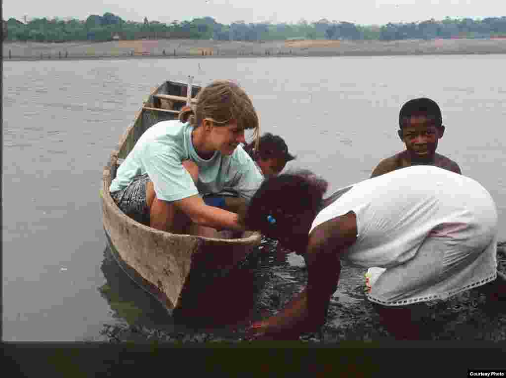Three Panamanian children taught Meredith Cornett (served in Panama between 1991 and 1993) to harvest clams during the dry season, and so many other important skills. (Submitted by Meredith Cornett)