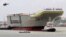 India's Indigenous Aircraft Carrier P-71 "Vikrant", built for the Indian Navy, leaves Cochin Shipyard after its launch in the southern Indian city of Kochi August 12, 2013. According to a media release, the 40,000 tonnes aircraft carrier, designed by the 