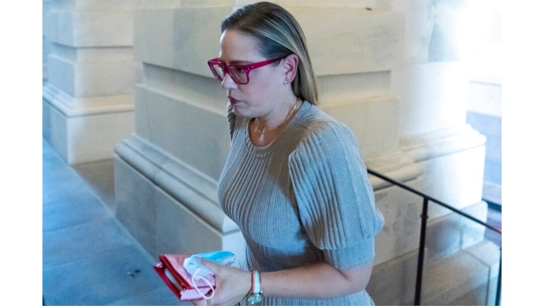 Sen. Kyrsten Sinema, D-Ariz., arrives for a vote on Capitol Hill, Nov. 1, 2021.