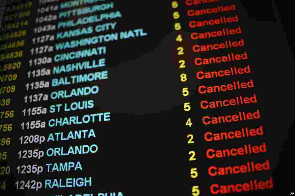 Flights are listed as cancelled as Bradley International Airport remains closed during a snowstorm in Windsor Locks, Connecticut, Jan. 27, 2015.